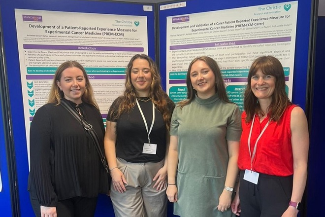 A photo of 4 women from the Christie Patient Centred Research team standing in front of a poster at a conference.