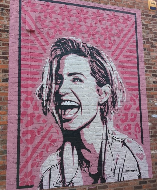 A photo of the pink Sarah Harding mural.