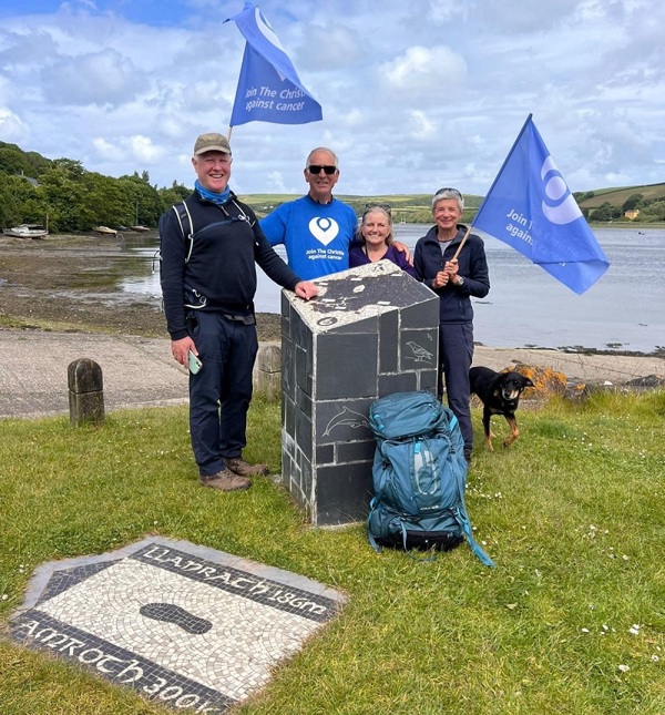 A photo of Professor Nick Slevin and Peter Walker with their partners Carrie and Helen completing the Pembrokeshire Coast Path trek.