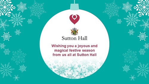 A graphic of a Christmas bauble reading 'Sutton Hall: Wishing you a joyous and magical festive season from us all at Sutton Hall'.