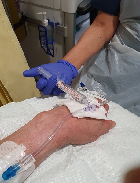 A photo of Christie patient Richard Nelson receiving a vaccine for bowel cancer.