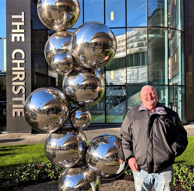 A photo of Christie patient William Bennett outside The Christie in Withington.