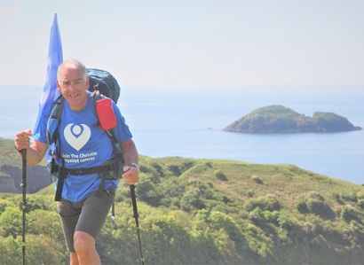 A photo of Peter Walker, walking the Pembrokeshire Coast Path to raise money for The Christie Charity.