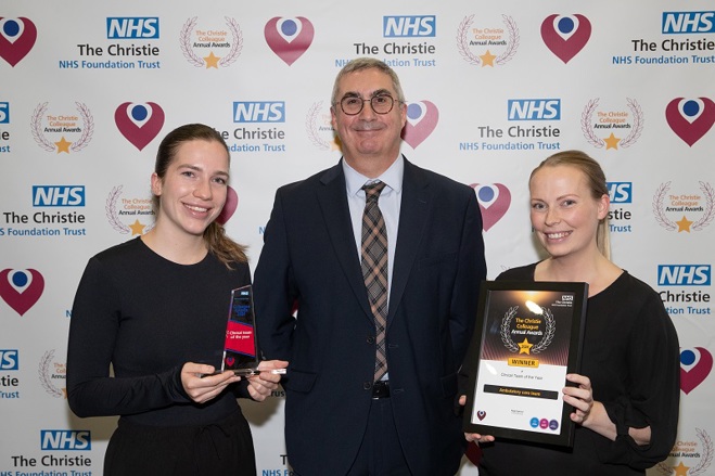 A photo of the ambulatory care team at The Christie receiving their Christie Colleague Award from Christie Chief Executive Roger Spencer.