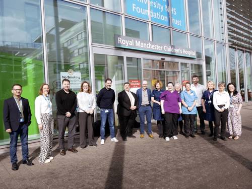A photo of the Manchester Neuro-oncology - Tessa Jowell Foundation accreditation team standing outside of the Royal Manchester Children's Hospital.