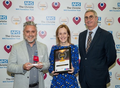 Dr. Richard Berman receiving his Christie Colleague Award from Christie Chief Executive Roger Spencer and his patient, Helen Hyndman.