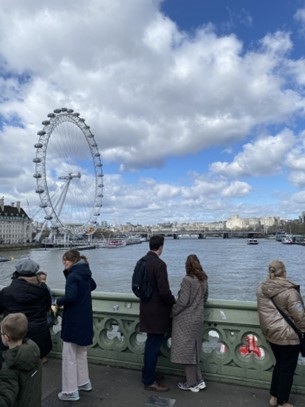 A photo of teenage protons patients from The Christie looking away from the camera at the London Eye.