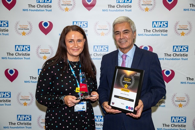 A photo of Gemma Butterworth receiving her Christie Colleague Award from Christie Non-executive Director Tarun Kapur.