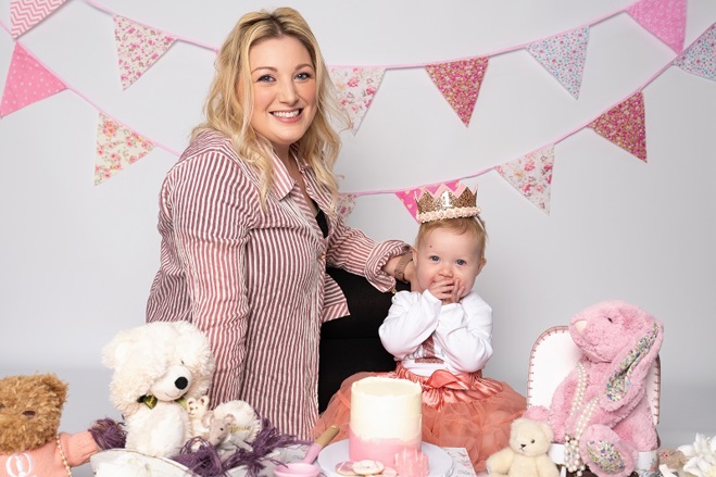 A photo of Christie patient Laura Hudson and her baby Aurora at a tea party.