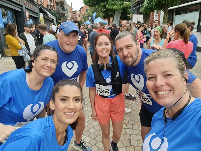 A photo of Christie Charity fundraisers the Blue Light Runners, all wearing blue Christie Charity t-shirts.