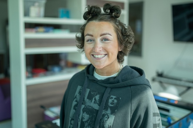 A photo of Christie patient Claudia Boardman wearing a Taylor Swift hoodie.