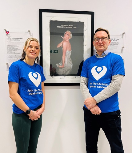 A photo of Manchester Cancer Research Centre’s Sally Best and consultant Dr Sacha Howell standing in front of the Sarah Harding plaque at The Christie.