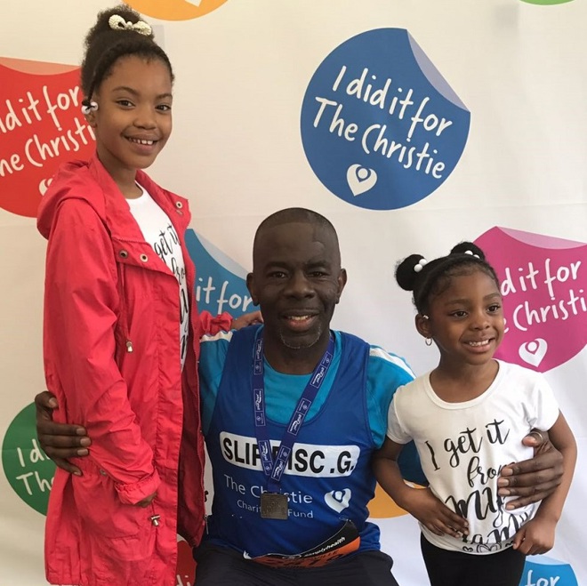 A photo of Christie fundraiser Granville Campbell and 2 young girls at the Great Manchester Run for The Christie Charity.
